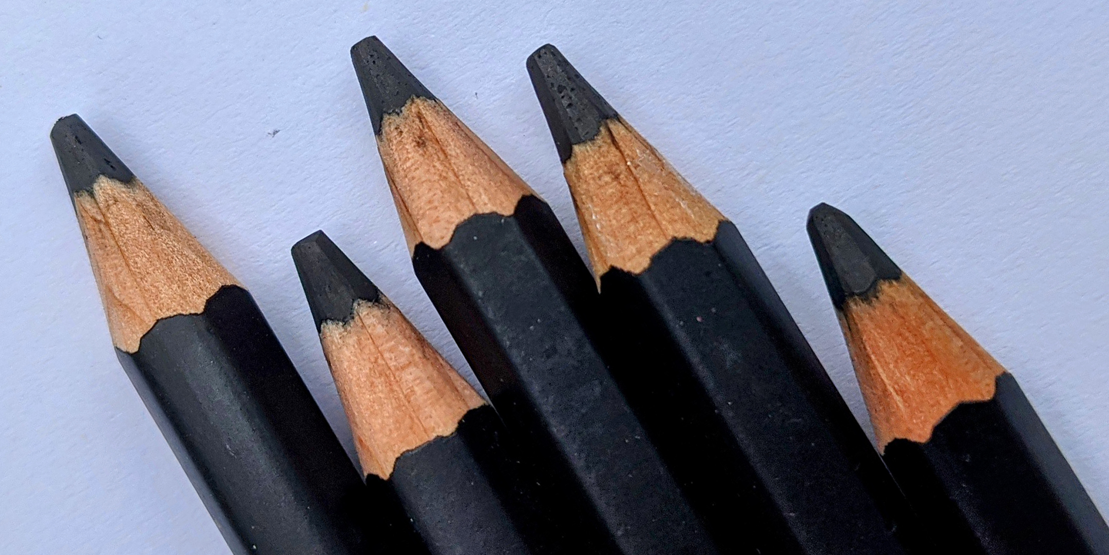 A photo of 5 blue pencils